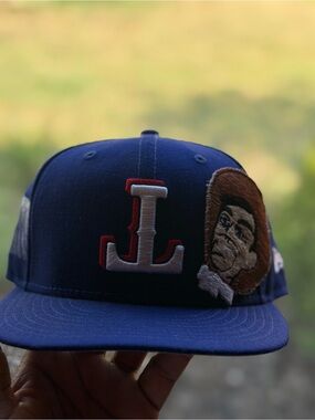 MLB Navy Snapback Hat with Embroidered 'L' and Character Patch